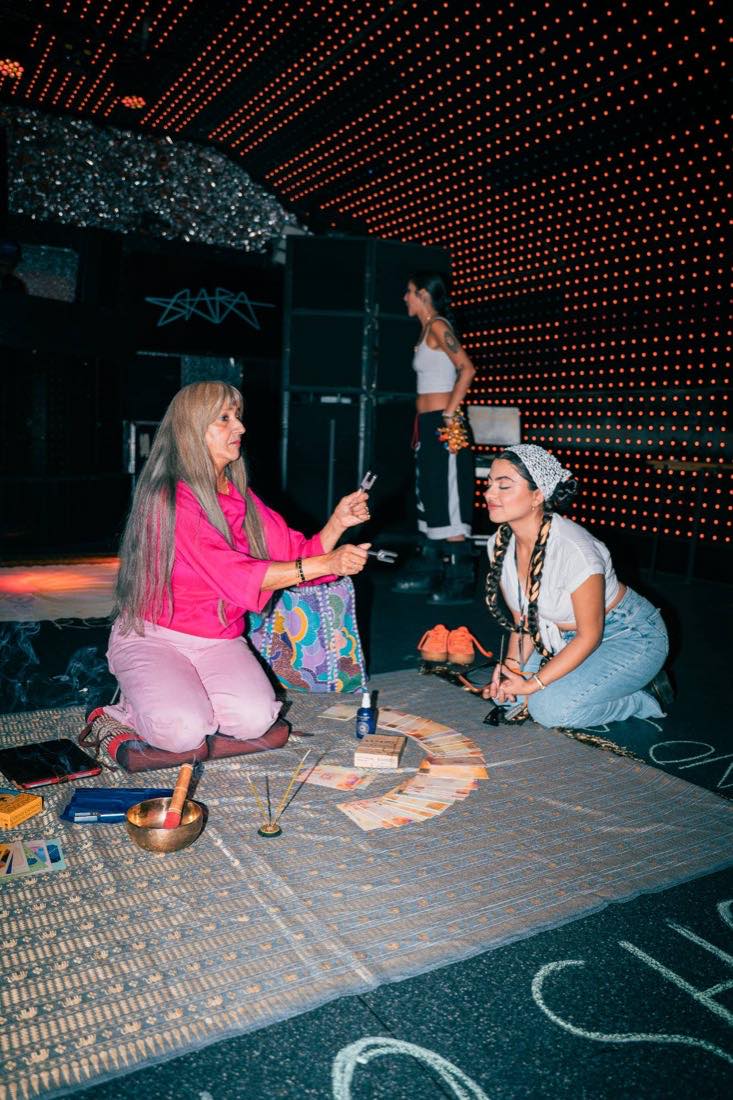 Sound bath and readings, set up on the floor under the LEDs.