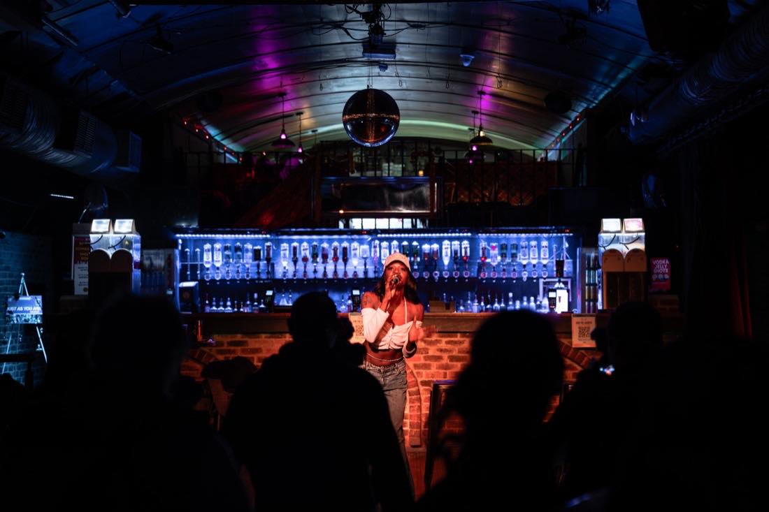 Singing to a room of silhouettes.