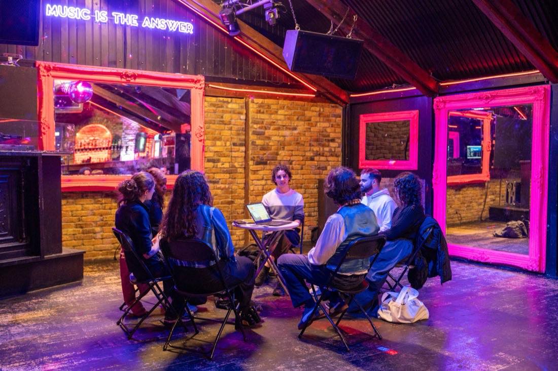 A circle of chairs under Music is the answer.