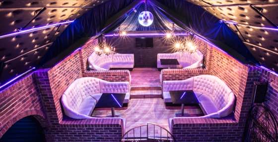 Protocol VIP — a quieter upstairs room with white leather booths